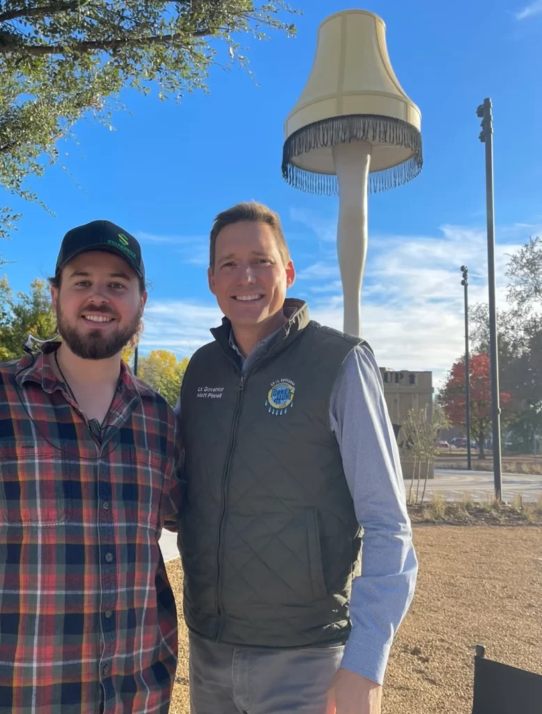 Filmmaker Reagan Elkins pictured with Oklahoma Lieutenant Governor Matt Pinnell near the Chickasha leg lamp monument featured in the Fragile movie documentary.